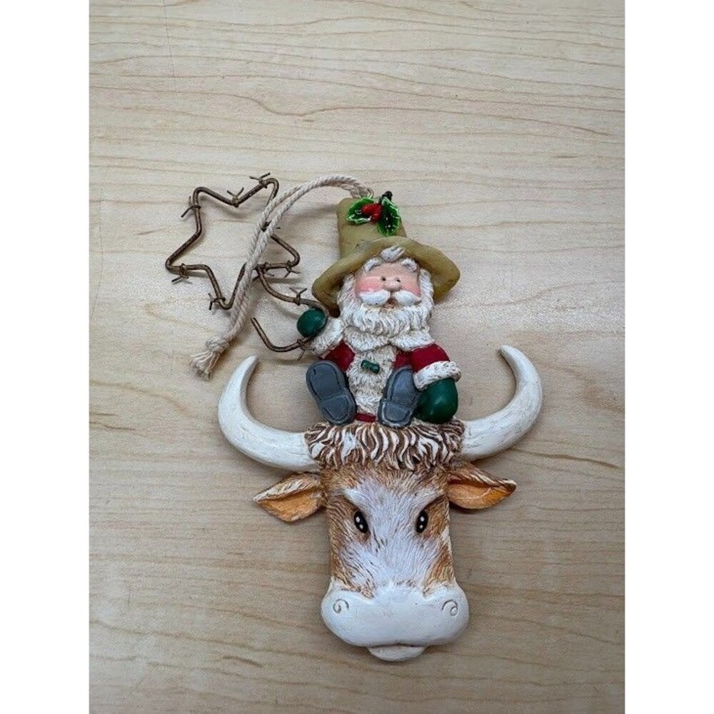Giordano Christmas Ornament Santa Cowboy Sitting on a Bull's Head with Star